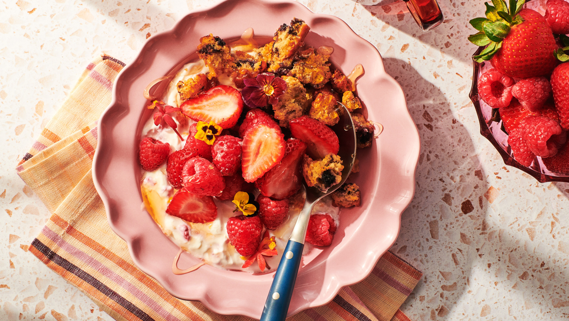 Image of Always Fresh Berry Parfait with Muffin Croutons in a pink bowl with spoon