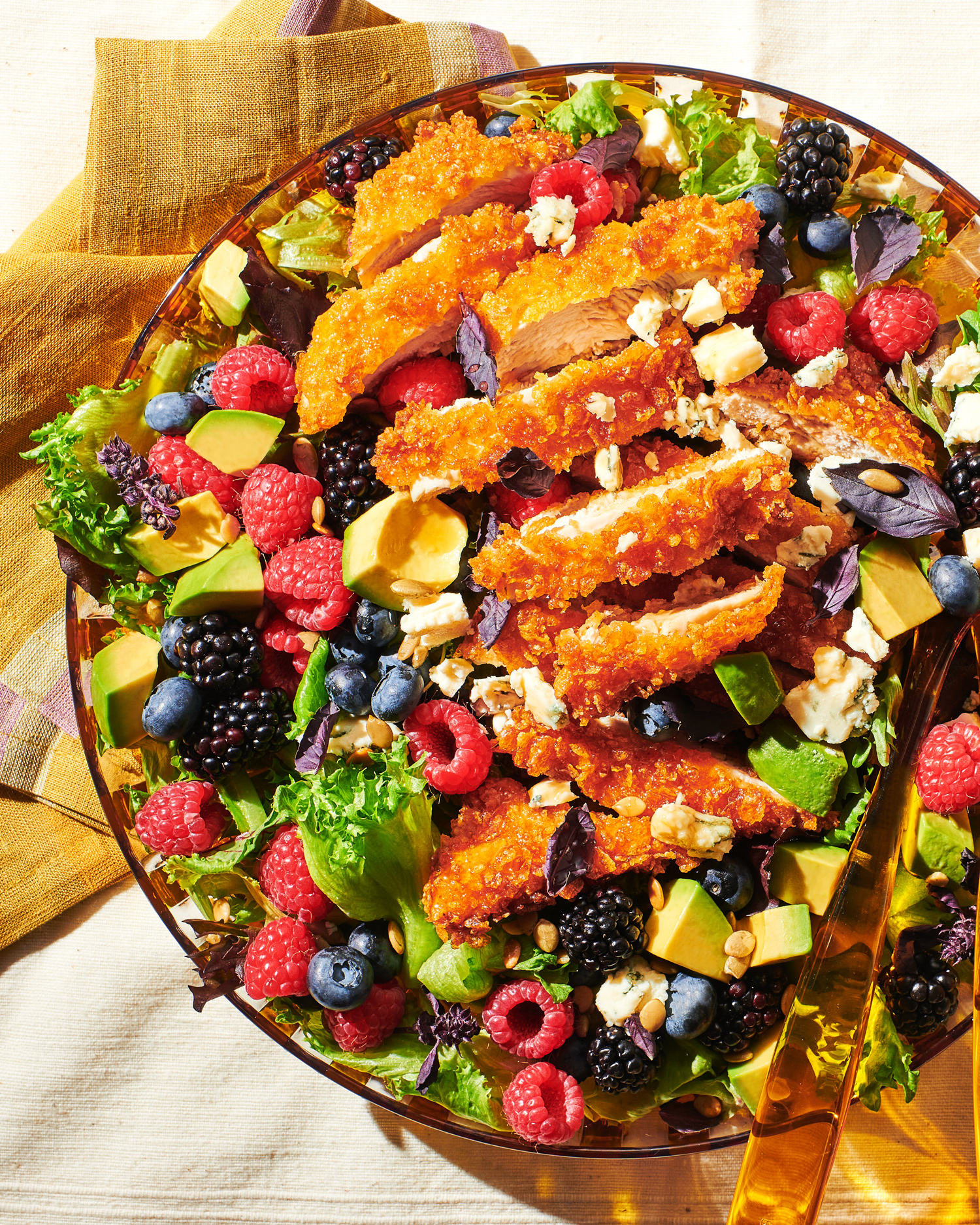Image of Always Fresh Hot Honey Fried Chicken and Berry Salad in a bowl with serving spoon