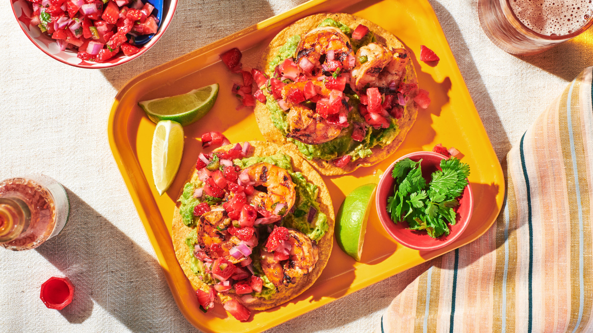Image of Always Fresh Shrimp Tostadas with Strawberry Salsa with a hot sauce bottle