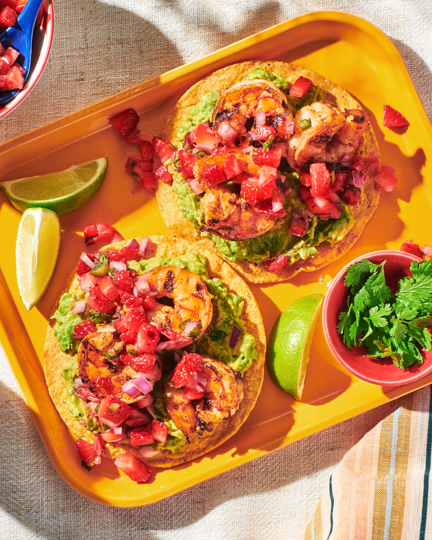 Image of Always Fresh Shrimp Tostadas with Strawberry Salsa with a hot sauce bottle