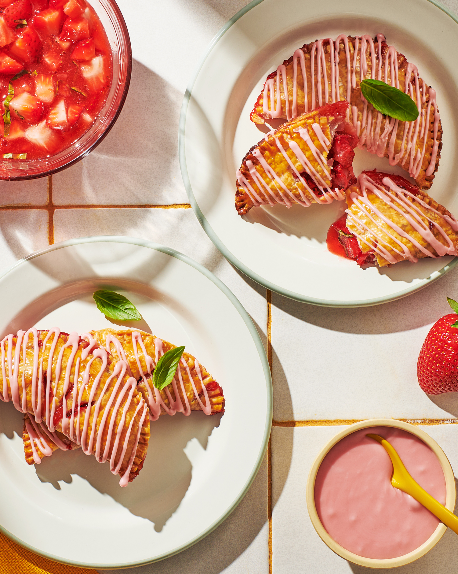 Image of Always Fresh strawberry basil hand pies on a plate with berry drizzle.
