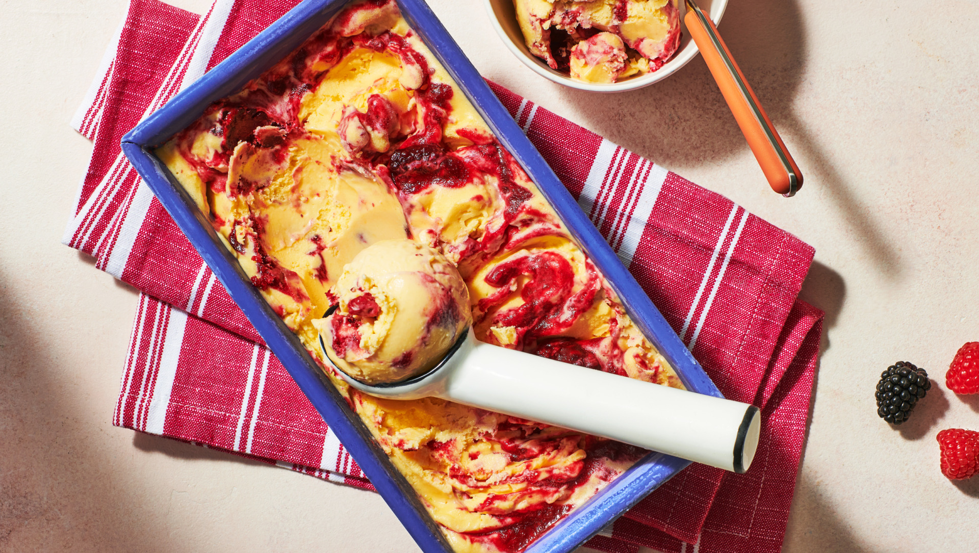 Image of Always Fresh Sweet Corn ice cream with a mixed berry swirl