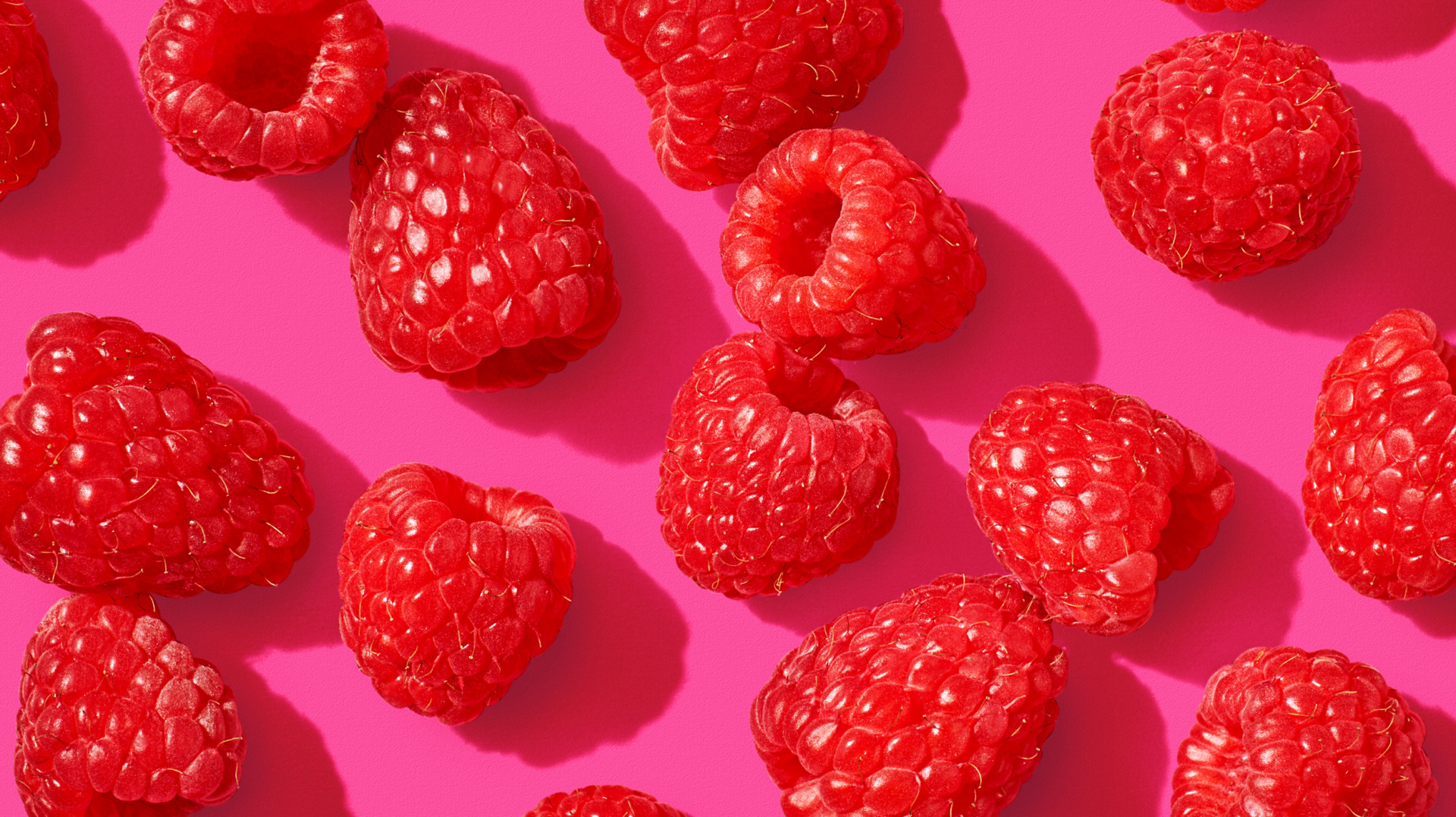 Image of Always Fresh raspberries on a pink background.